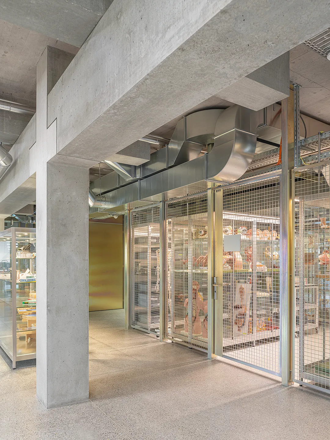 Architecture Photography of a modern brutalist-style school buildings, Kantonsschule Limmattal, featuring light gray-brown recyled-concrete facades, interior view with prefabricated concrete structure by ingegneri pedrazzini guidotti, designed for PENZISBETTINI in Urdorf, Zürich.